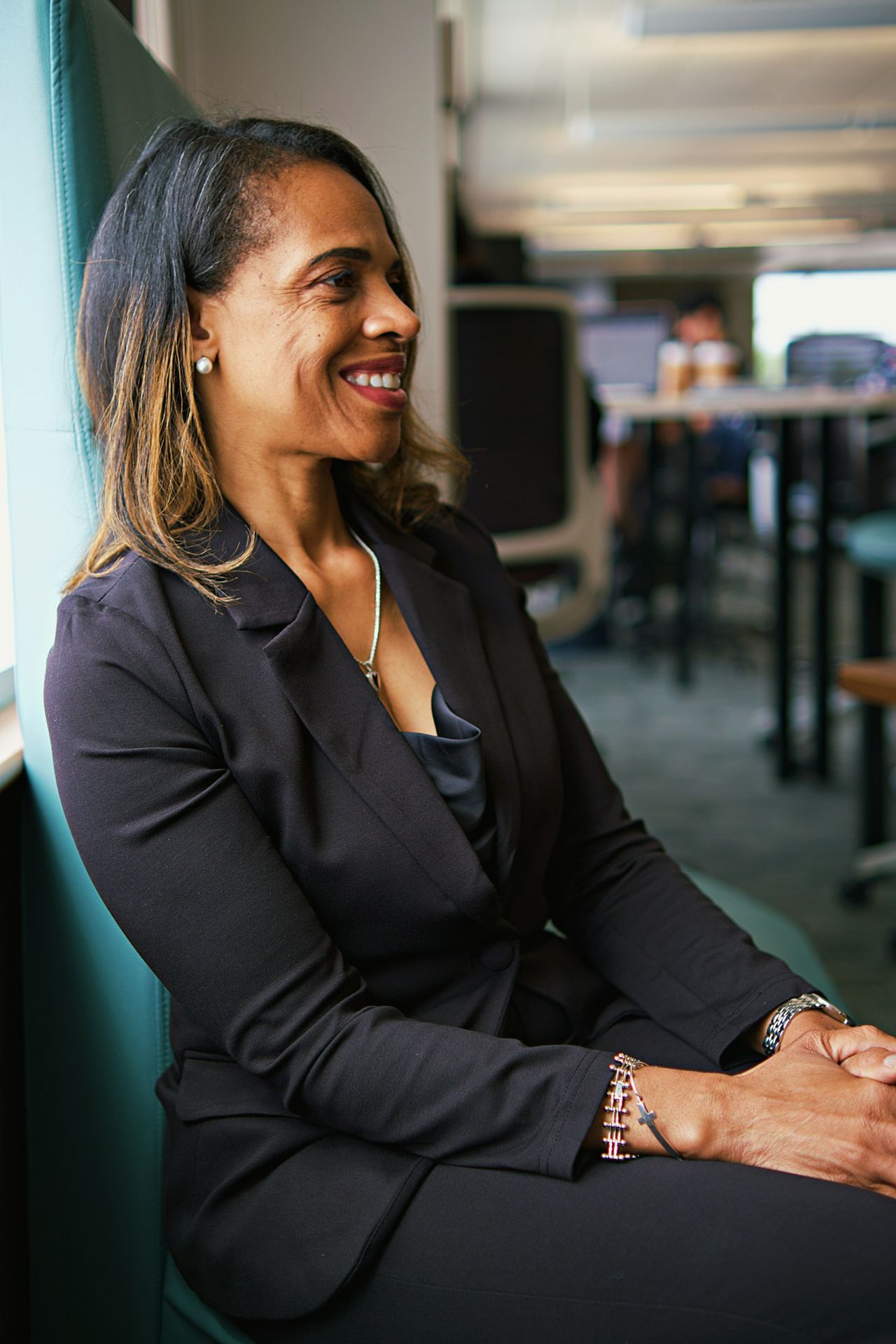 A woman sitting on a chair in an office